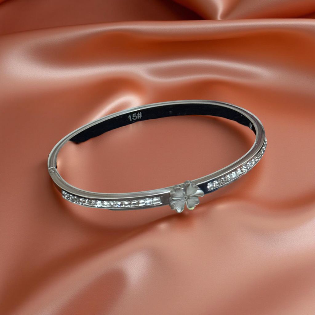 Elegant women's bracelet made of stainless steel with flower motif and rhinestones – silver-colored