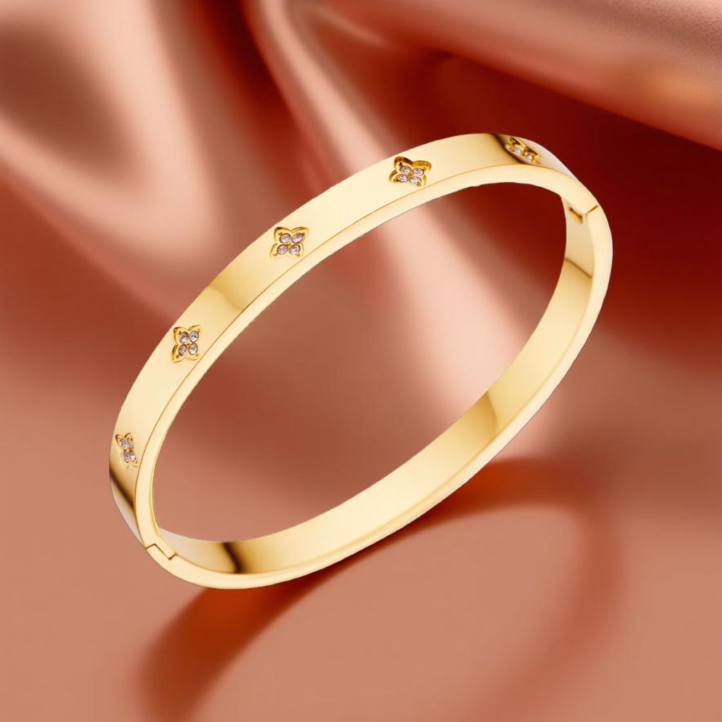 Luxuriöses Damen-Armband aus Edelstahl in Goldoptik mit Zierblüten und Zirkonia